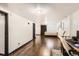 Finished basement space with wood-look floors, a bed, and a desk, offering flexible use at 1364 Lansing St, Aurora, CO 80010