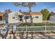 Charming single-story home featuring a well-maintained front yard with a classic white picket fence at 1364 Lansing St, Aurora, CO 80010