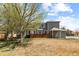 Spacious backyard featuring privacy fence, mature tree and well maintained lawn at 2231 E 128Th Ave, Thornton, CO 80241