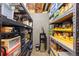 Organized basement storage area featuring shelving units and household items at 2231 E 128Th Ave, Thornton, CO 80241