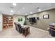 Finished basement with a recliner, a wall-mounted TV, and recessed lighting at 2231 E 128Th Ave, Thornton, CO 80241