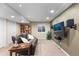 Basement featuring a leather sofa, mounted TV, and recessed lighting at 2231 E 128Th Ave, Thornton, CO 80241