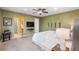 Spacious bedroom with carpeted floors, ensuite bathroom, and a contemporary ceiling fan at 2231 E 128Th Ave, Thornton, CO 80241