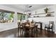 Cozy dining area with natural light, hardwood flooring, and a charming decorative shelf at 2231 E 128Th Ave, Thornton, CO 80241
