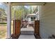 View of the patio area from the backyard through the backyard gate at 2231 E 128Th Ave, Thornton, CO 80241
