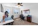 Office space with sewing machine and supplies, lots of natural light, and a neutral palette at 2231 E 128Th Ave, Thornton, CO 80241