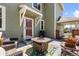 Covered patio with comfortable seating, grill, fire pit, and outdoor living space at 2231 E 128Th Ave, Thornton, CO 80241