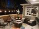 Relaxing outdoor patio with fire pit, stylish seating, and string lights at 2231 E 128Th Ave, Thornton, CO 80241