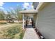 Charming side yard with walkway, lighting, mature trees, and lush lawn at 2231 E 128Th Ave, Thornton, CO 80241