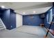 Basement rec room with TV, closet, and neutral carpet and paint at 4873 Eckert St, Castle Rock, CO 80104