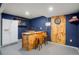 Basement bar and rec room area with space to entertain, a dart board, and a fridge at 4873 Eckert St, Castle Rock, CO 80104