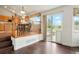 Dining area featuring wood floors, a view to the backyard, and access to the kitchen at 4873 Eckert St, Castle Rock, CO 80104