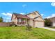 Traditional two-story home featuring an inviting covered front porch and a well-maintained lawn at 4873 Eckert St, Castle Rock, CO 80104