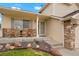 Cozy front porch with charming decor and a welcoming entrance at 4873 Eckert St, Castle Rock, CO 80104
