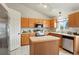 Bright kitchen with wooden cabinets, stainless steel appliances, and center island at 4873 Eckert St, Castle Rock, CO 80104