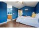 View of main bedroom leading to main bathroom, featuring vaulted ceilings and wood laminate flooring at 4873 Eckert St, Castle Rock, CO 80104