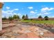 Paver patio area with large yard and rock beds in the backyard at 4873 Eckert St, Castle Rock, CO 80104