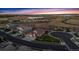 Serene aerial shot of a neighborhood showcasing well-maintained homes, winding streets, and surrounding open spaces at 15994 La Plata Peak Pl, Broomfield, CO 80023