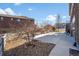 Backyard features a gravel area and a large concrete area for parking or entertainment purposes at 15994 La Plata Peak Pl, Broomfield, CO 80023