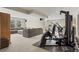 Spacious basement featuring a workout area, comfortable lounge seating, and plenty of room for recreation at 15994 La Plata Peak Pl, Broomfield, CO 80023