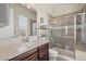Bright bathroom featuring a walk-in shower and tile flooring at 15994 La Plata Peak Pl, Broomfield, CO 80023