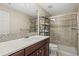 Bathroom featuring a vanity, mirror, and glass shower, with stylish tile accents at 15994 La Plata Peak Pl, Broomfield, CO 80023