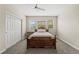 Bedroom with a traditional bed, carpeted floors, and a view of the neighborhood at 15994 La Plata Peak Pl, Broomfield, CO 80023
