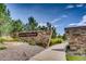 A stone sign reading 'Anthem Highlands' amid lush greenery and a welcoming pathway at 15994 La Plata Peak Pl, Broomfield, CO 80023
