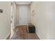 Welcoming home hallway with neutral tones, bench seating, and tile flooring, creating a clean and open entryway at 15994 La Plata Peak Pl, Broomfield, CO 80023