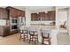 Modern kitchen features granite counters, stainless appliances and dark wood cabinets at 15994 La Plata Peak Pl, Broomfield, CO 80023