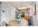 Bright eat-in kitchen featuring wooden cabinets, stainless appliances, and hardwood floors at 13245 Shoshone St, Denver, CO 80234