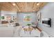Inviting living room with natural light, hardwood floors, and a modern fireplace at 13245 Shoshone St, Denver, CO 80234