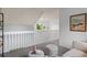 Loft features a cozy sitting area with a scenic window view and natural lighting at 13245 Shoshone St, Denver, CO 80234