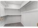 A walk-in closet has ample shelving and metal clothes rods for organization and storage at 13245 Shoshone St, Denver, CO 80234