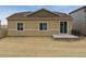 Exterior view of the backyard with a patio and new lawn at 18308 Martinello Dr, Parker, CO 80134