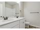 Bathroom featuring double sinks with modern fixtures and a tile shower at 18308 Martinello Dr, Parker, CO 80134