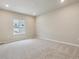 Neutral bedroom with plush carpeting, recessed lighting, and bright window views at 18308 Martinello Dr, Parker, CO 80134