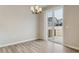 Bright dining area with luxury vinyl plank flooring and access to the outdoor patio at 18308 Martinello Dr, Parker, CO 80134