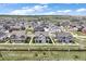 Aerial view of a well-planned community surrounded by open space and rolling hills at 14096 Red Cosmos St, Parker, CO 80134