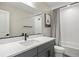 Stylish bathroom featuring a modern vanity, framed mirror, and tiled shower at 14096 Red Cosmos St, Parker, CO 80134