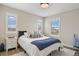 Bright bedroom with natural light, shuttered windows, and a comfortable bed at 14096 Red Cosmos St, Parker, CO 80134