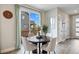 Cozy dining area with sliding glass doors, letting in lots of natural light, with views of the fenced backyard at 14096 Red Cosmos St, Parker, CO 80134