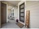 Inviting front porch featuring chairs, plants, a 'Welcome' sign, and the house number, creating a cozy entrance at 14096 Red Cosmos St, Parker, CO 80134