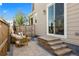 Paver patio with outdoor furniture, privacy fence, and sliding glass door access to the home at 14096 Red Cosmos St, Parker, CO 80134