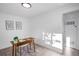 A well-lit home office featuring minimalist design and a view through the window at 3980 S Hazel Ct, Englewood, CO 80110