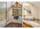 Charming bathroom offers natural light, a stylish vanity, and a shower/tub combo at 5724 Highway 9, Breckenridge, CO 80424