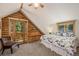 Bright bedroom features a balcony with a view, a ceiling fan, and natural wood trim at 5724 Highway 9, Breckenridge, CO 80424