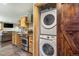 Efficient kitchen with stainless steel appliances and laundry machines in a rustic modern home at 5724 Highway 9, Breckenridge, CO 80424