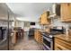 Well-lit kitchen featuring stainless steel appliances and seamless flow to the living room at 5724 Highway 9, Breckenridge, CO 80424
