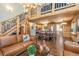 Spacious living room with hardwood floors, wooden beams, an open floor plan, and a lovely kitchen at 5724 Highway 9, Breckenridge, CO 80424